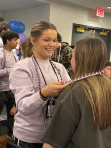 Students receiving their senior cord