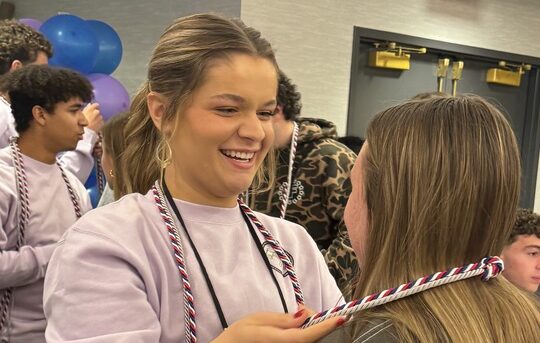 Students receiving their senior cord