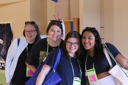 4 volunteers smiling